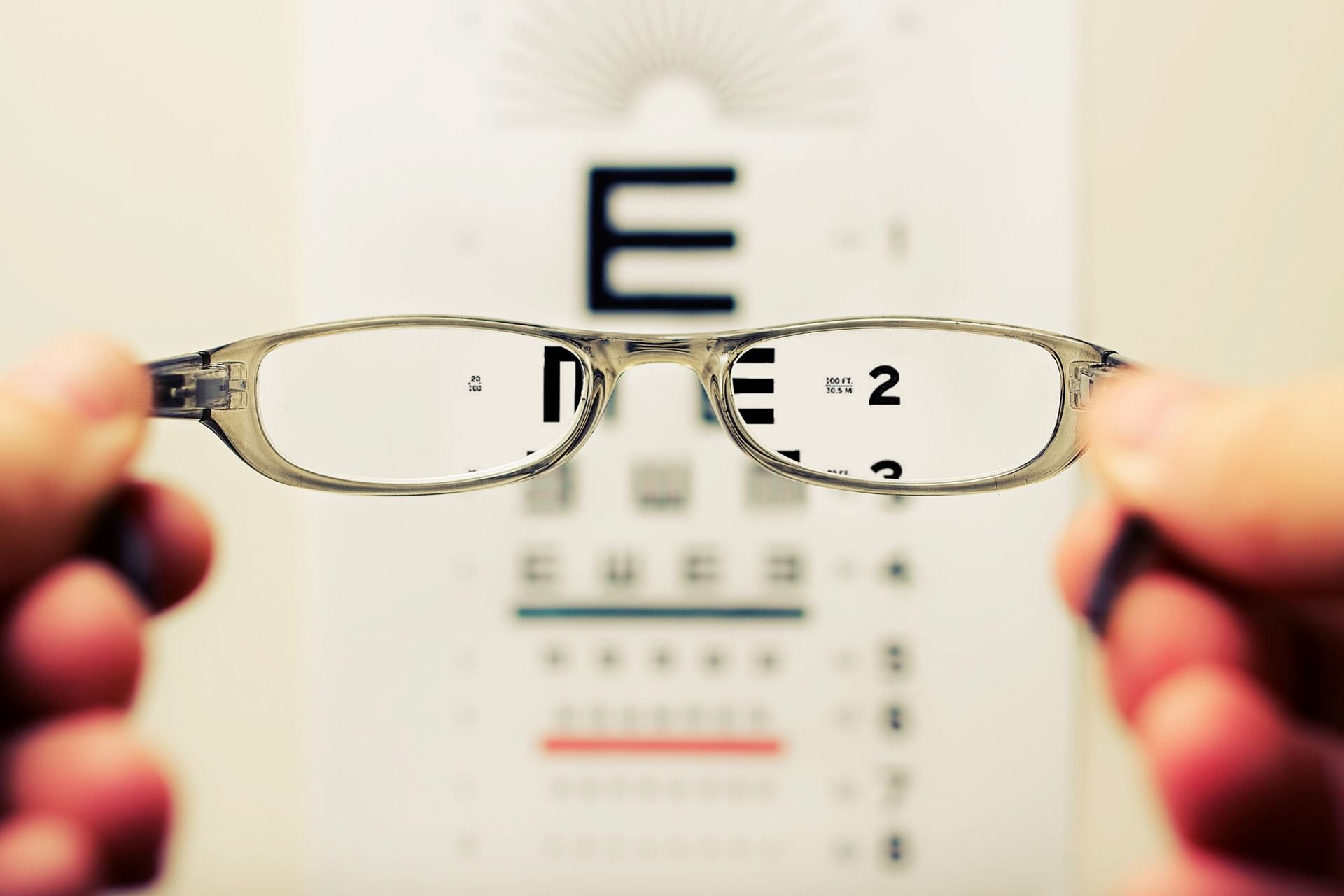 an eye chart and a pair of glasses