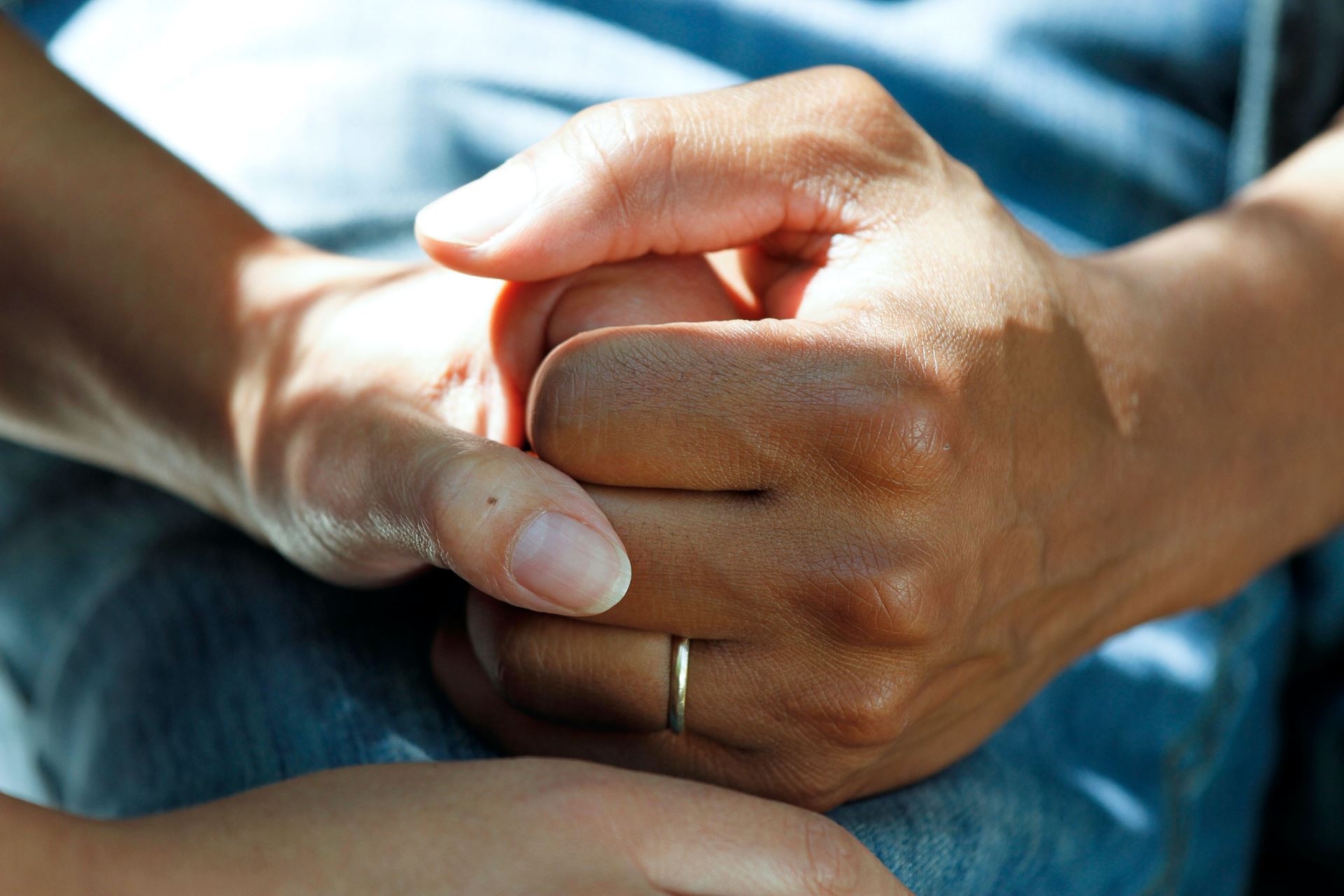 a person holding another person's hand