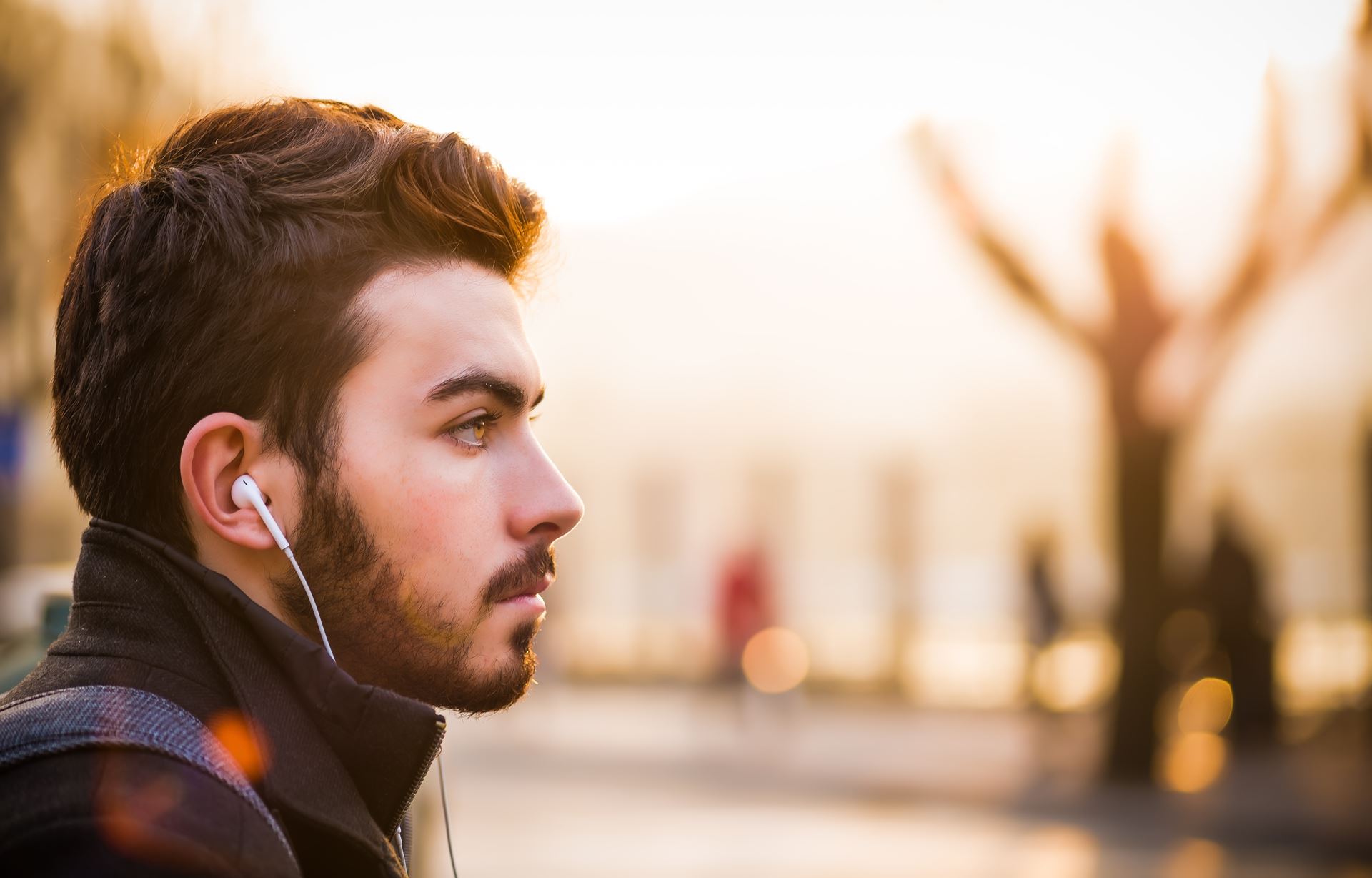 a man walking with head phones