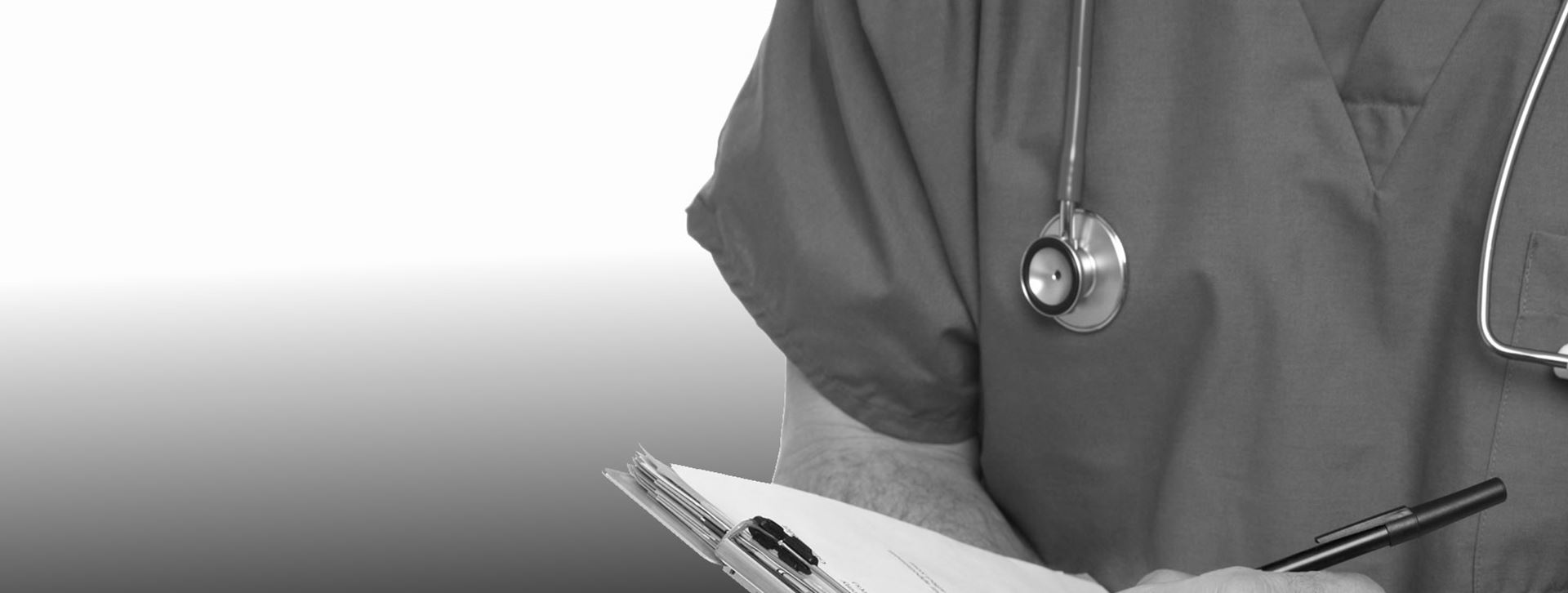 a clinician with a stethoscope around their neck holding a clip board